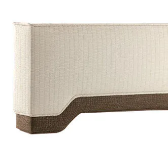 Beige upholstered headboard with a curved bottom edge against a white background.