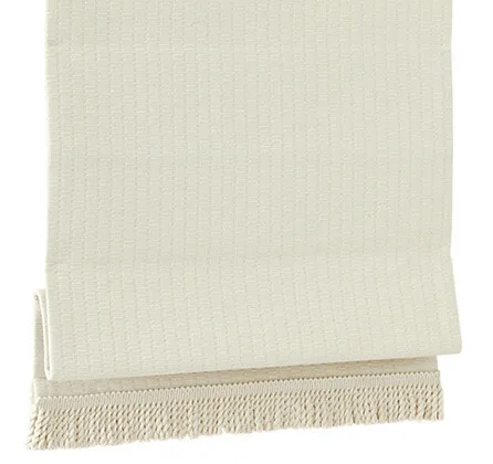 A folded beige cotton towel on a white background.