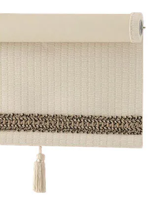 Beige roller blind with decorative fringe and tassel, isolated on white background.