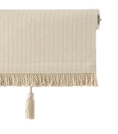 Beige roller blind with textured fabric and tassel detail on a white background.